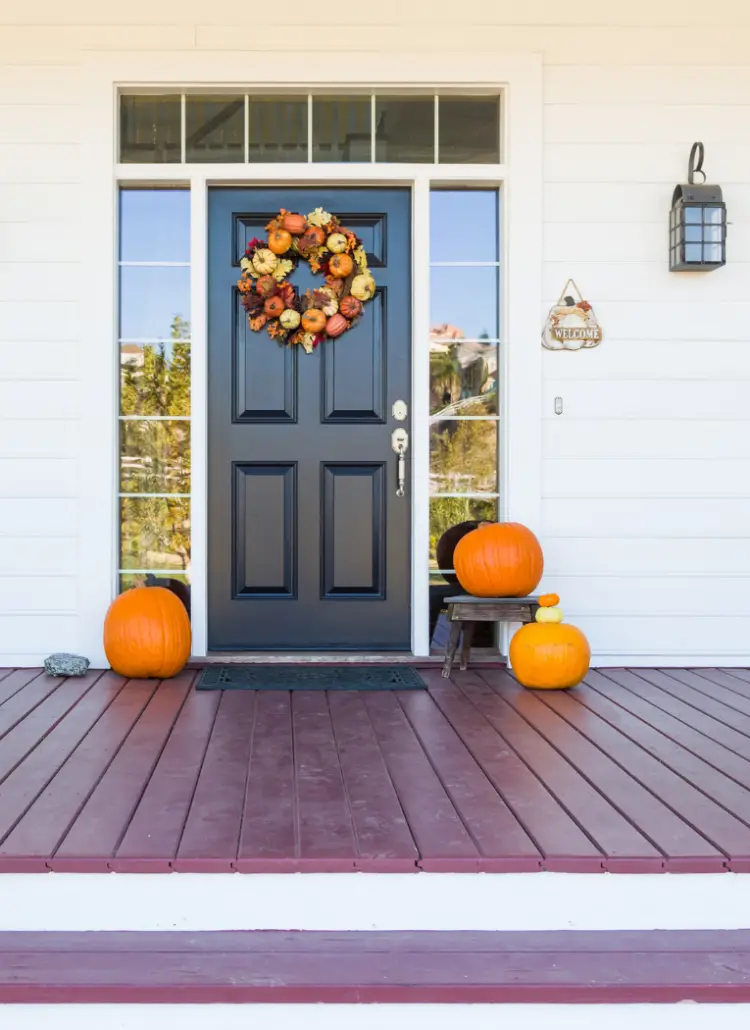 Front door with pumpkins